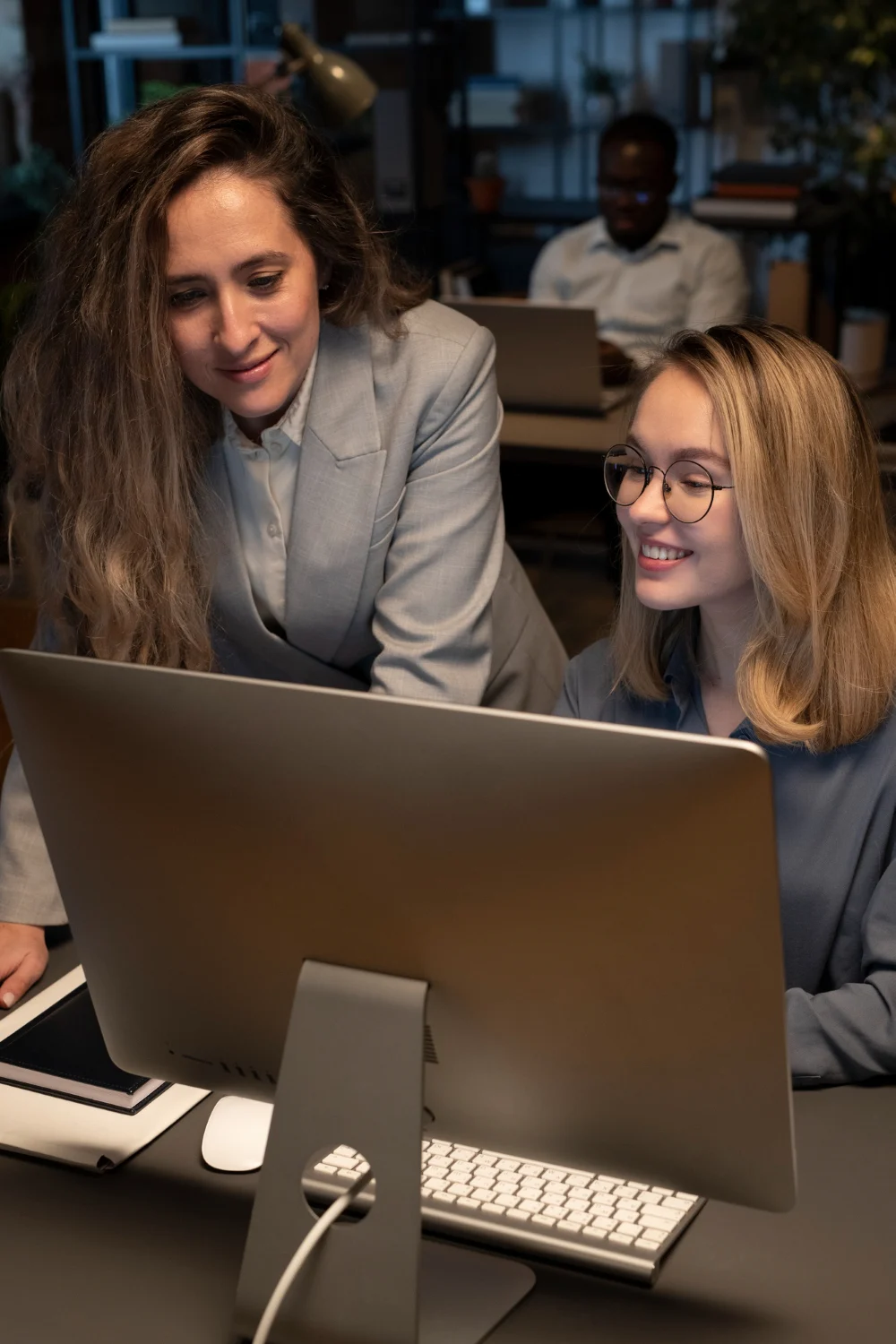 Two colleagues reviewing work together