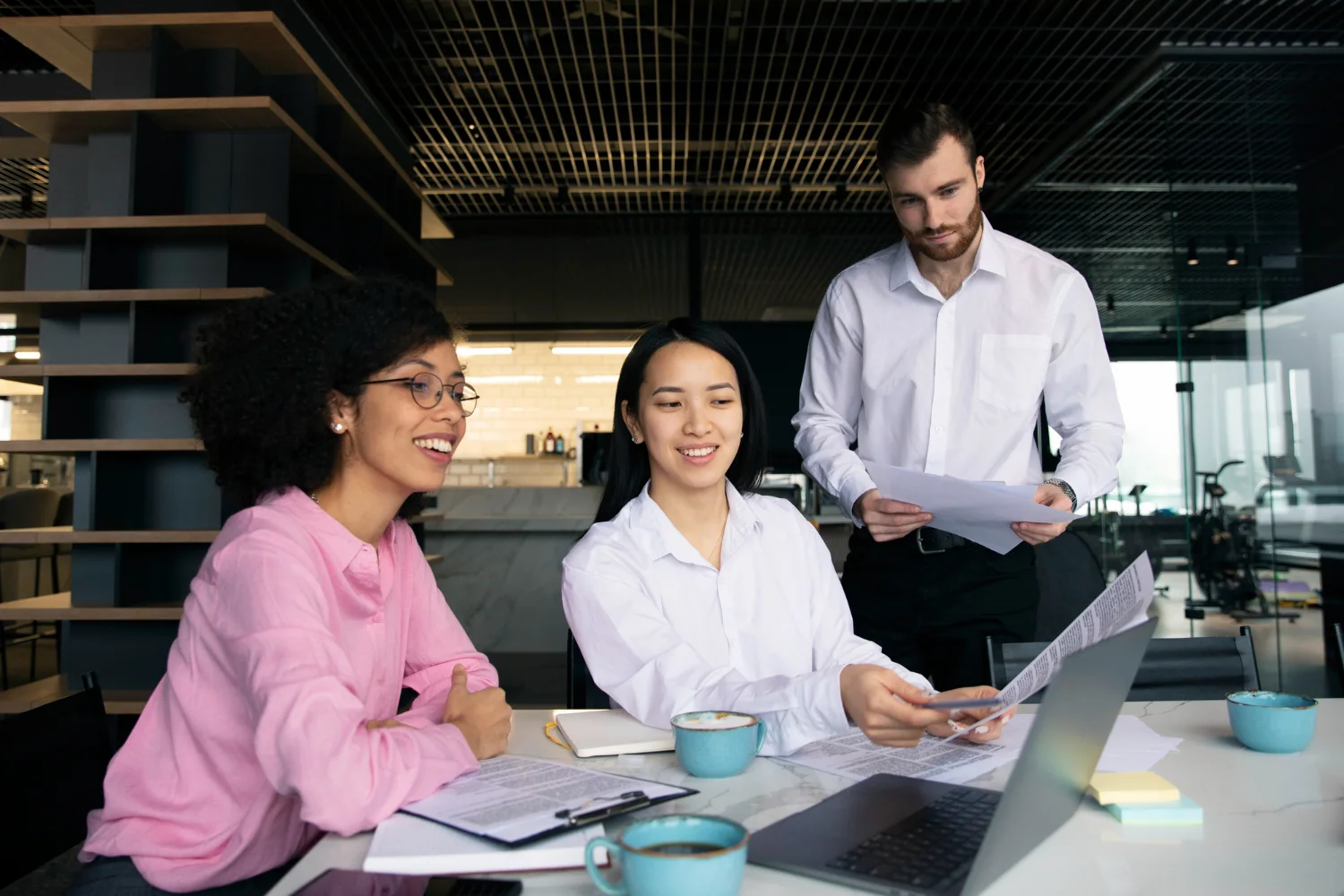 Technology team collaborating around a table